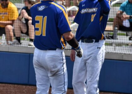 Jacob Spanyer of Spalding University celebrates a big play at the plate.