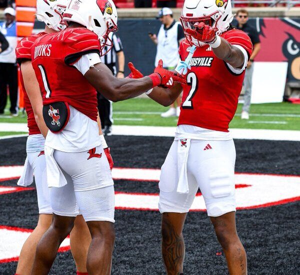 Louisville Football player Jadon Thompson (2) celebrates after a touchdown with Ja'Corey Brooks (1) and Tyler Shough (9).