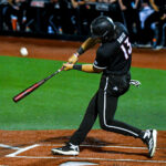 Tague Davis swings at a pitch in a Louisville Baseball Game Photo by Jared Anderson