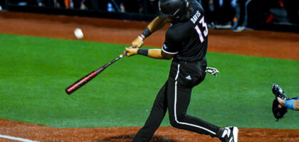 Tague Davis swings at a pitch in a Louisville Baseball Game Photo by Jared Anderson
