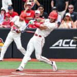 Lucas Moore swings at a pitch at Jim Patterson Stadium