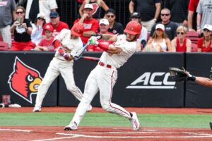 Lucas Moore swings at a pitch at Jim Patterson Stadium