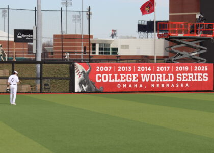Left Fielder Griffin Crain and the College World Series Banner in Left Center Field at Jim Patterson Stadium Photo by Ryan Hammel